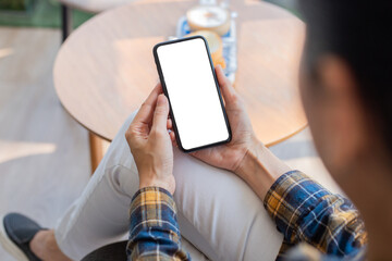cell phone blank white screen mockup.woman hand holding texting using mobile on desk at office.background empty space for advertise.work people contact marketing business,technology