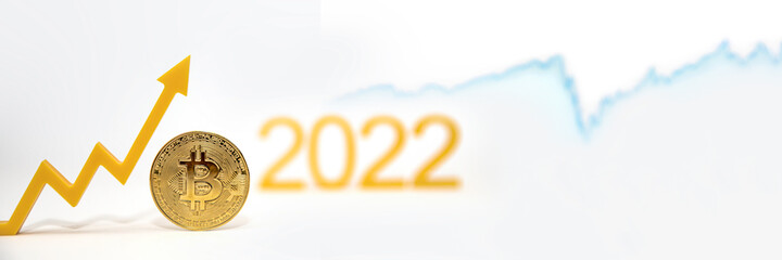 Bitcoin. Bitcoin price in 2022. Popular cryptocurrency rate. The Bitcoin coin on the price chart is pointing upwards against a white background. Banner for design or text insertion.