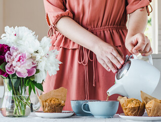 Young woman and a beautiful bouquet of flowers. Close-up. Studio photo