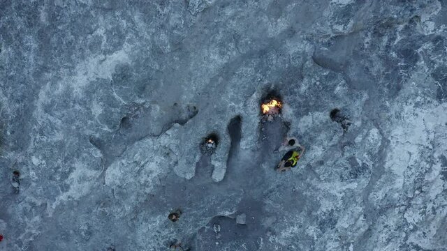 Top aerial view of burning fires from vents in rocks-inspiration for the fire breathing Chimaera monster. Natural gas flames burning at Yanartas, Cirali, Olympos, Turkey