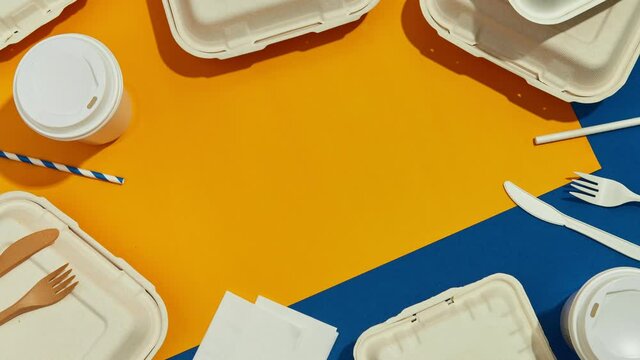 Lunchbox and Cutlery on Colorful Table. Flat lay Top view Food Delivery Concept