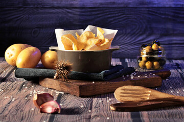 still life bowl of potato chips. Appetizers and snacks. culinary photography rustic and dark