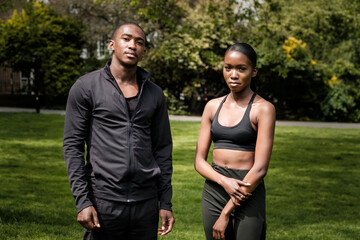 Black brother and sister twins posing outdoor in stylish sportswear.