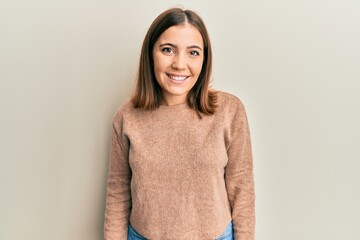 Young beautiful woman wearing casual clothes with a happy and cool smile on face. lucky person.