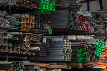 Stock warehouse many kind of steel tube, pipes round steel. manufacturing and building systems. , Noise,Out of focus.