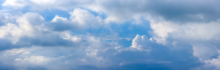 Cloudy blue sky with soft sun reflection panorama