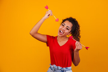 Photo of a girl holding Cupid's arrows.