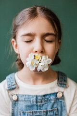 child girl flowers lips closed eyes spring