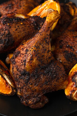 Appetizing slow roasted duck leg with oranges