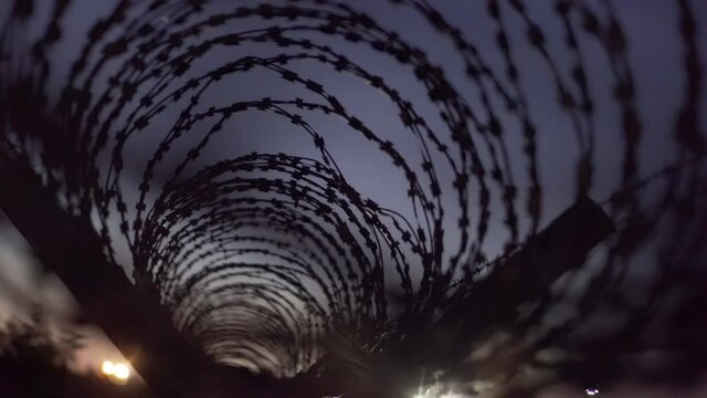 Barbed wire in the night, abstract background
