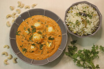 Egg butter masala and Green peas Pulav. A boiled egg dish with rich creamy gravy along with Green peas pulav
