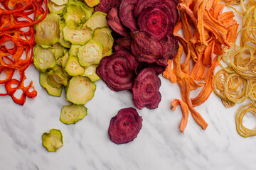 Dehydrated vegetables heap isolated on white as a snack for vegetarians