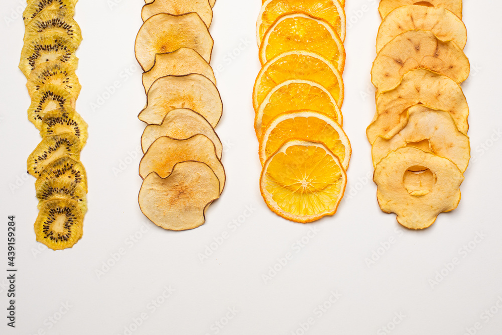 Canvas Prints The dry pieces of different fruits in a row to fresh fruits