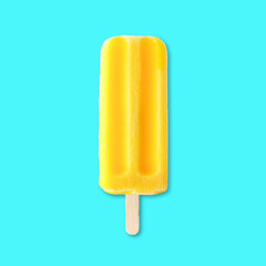 Yellow summer ice pop against a bright blue background