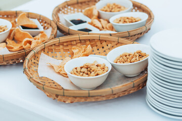 napkin, bowls with raisins, peanuts, sunflower seeds