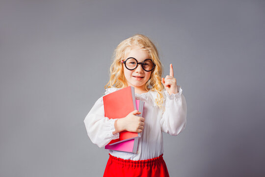 The Pretty Little Girl With Glasses Dressed In Teacher Uniform