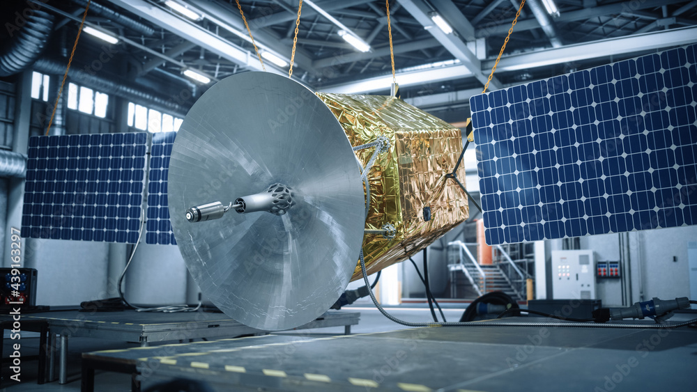 Wall mural Satellite Under Construction in Aerospace Technology Manufacturing Facility. Development of Spacecraft for Space Exploration, Navigation, Communications, Internet Telecommunication, Observation 