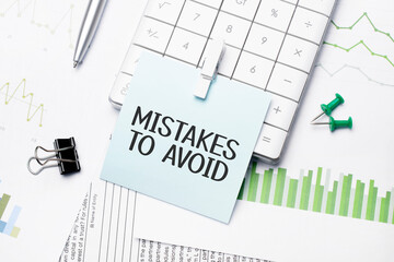 text mistakes to avoid. Written words on paper notebook . workplace. Business concept.