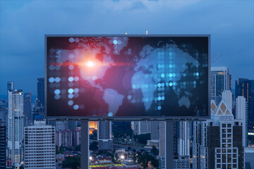 Hologram of Earth planet map on billboard over night panoramic cityscape of Kuala Lumpur, Malaysia, Asia. The concept of international companies in KL. Globe