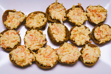 crispy buns with cheese salad filling; view from the top ; brown and yellow tones