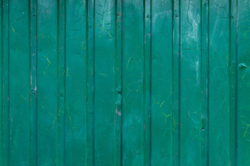 Naklejka premium Texture of dirty blue-green iron fence. Iron sheet. Background. Space for text.