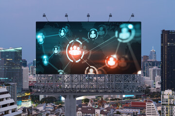 World planet Earth map hologram of social media icons over sunset panoramic cityscape of Bangkok, Southeast Asia. The concept of people connections.