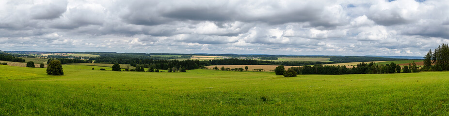 Fototapeta na wymiar Panoramic view of meadows and woods, region Vysocina, Czech republic