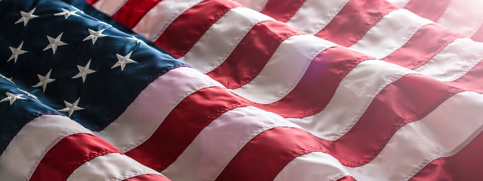 American Flag background. 4th of July, Independence, Memorial or Presidents Day. United States of America. USA patriotic freedom democracy symbol. Waving on a wind flag. High resolution close up photo