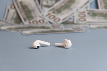 Dollars background, hundred USA dollar banknote bills, many American cash money, selective focus and  headphone