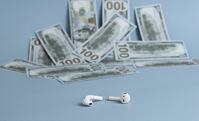 Dollars background, hundred USA dollar banknote bills, many American cash money, selective focus and  headphone
