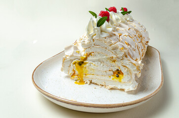 chocolate biscuit cake with nuts. with condensed milk on a white platter High quality photo