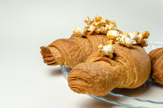croissants with popcorn on a platter. High quality photo
