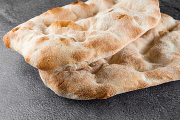 Dough for pinsa romana and scrocchiarella gourmet italian cuisine. Traditional dish in italy. Food delivery from pizzeria.