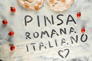 Dough and flour with text pinsa romana italiano on black background. Scrocchiarella gourmet italian...