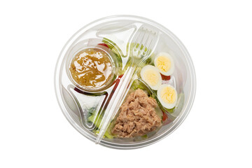 Fresh tuna salad with lettuce, cucombers, cherries and eggs in plastic container.