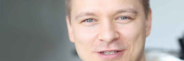 Fototapeta premium Portrait of young handsome smiling caucasian man