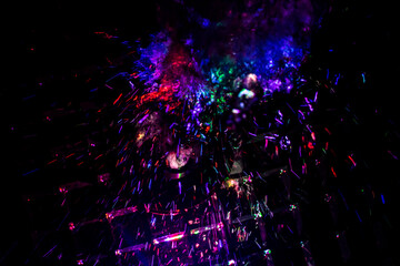 Colored water texture. Splashes of water lit in different colors.