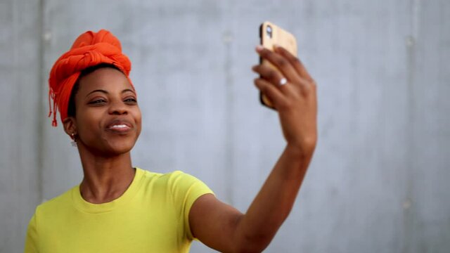 Young woman using smart phone outdoors

