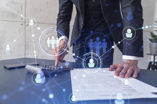 HR specialist researching and analyzing the data of salary on employment market to forecast ongoing expenses of the company using calculator. Hiring new talented officers. Social media hologram icons