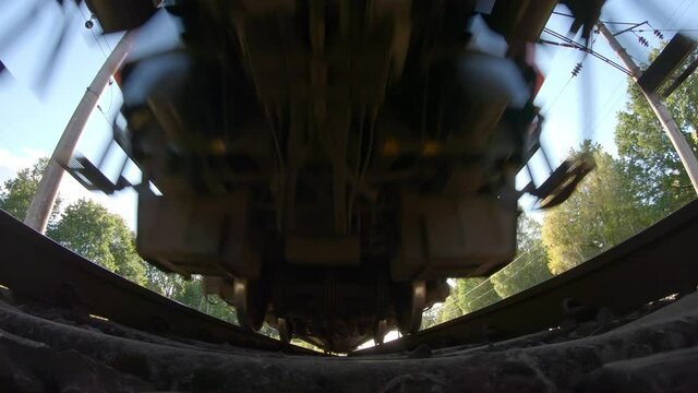 Passing train bottom view, slow motion