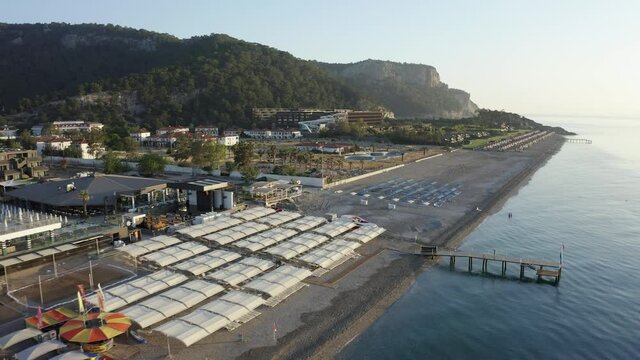 Aerial fly over resorts on Kiris. Coastline with luxury hotels in Kemer, Turkey