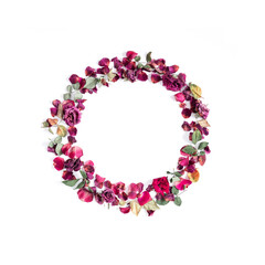 Wreath is made of dried rose flowers. Dried roses on  white background. Flat lay, top view, copy space