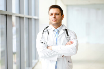 Male doctor standing in the modern clinic. Perfect medical service in the hospital. Medicine and healthcare concept