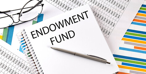 Notebook with text ENDOWMENT FUND . Diagram and white background