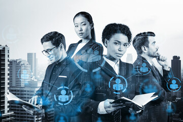 Obraz premium Group of SMM specialists working on social media marketing strategy to achieve business goals. Hologram icons over Bangkok background.