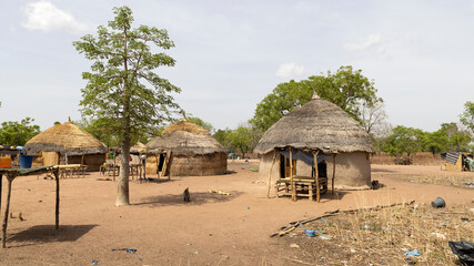 Traditional African village grass huts north Ghana. Rural traditional mud and straw huts and...