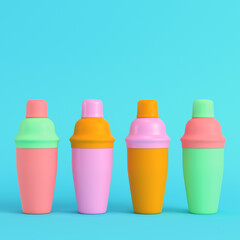 Colorful cocktail shakers on bright blue background in pastel colors. Minimalism concept