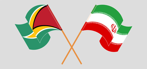 Fototapeta na wymiar Crossed and waving flags of Guyana and Iran