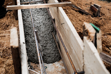 Timber formwork with metal reinforcement for pouring concrete and creating a solid foundation for a...