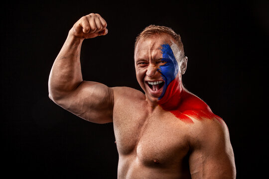 Czech Republic fan. Soccer or football athlete with flag bodyart on face. Sport concept with copyspace.